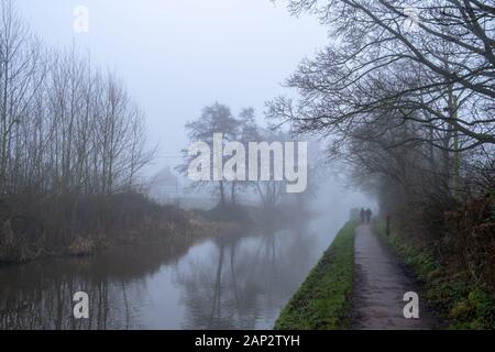 Foggy English winter morning. Walk next to Trent and Mersey Canal in Staffordshire, near the small town Stone. Stock Photo