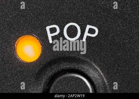 Macro close up photograph of vintage tape machine pop music preset button and indicator light. Stock Photo