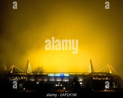 Dortmund, Germany, January 20, 2020: Signal Iduna Park (Westfalenstadion) at night. In the stadium of the Bundesliga club BvB Borussia Dortmund, the lawn is artificially illuminated at night, the light shines yellow in the evening sky.   ---   Dortmund, 20.1.2020: Signal Iduna Park (Westfalenstadion) bei Nacht. Im Stadion des Bundesligavereins BvB Borussia Dortmund wird nachts der Rasen künstlich beleuchtet, das Licht strahlt gelb in den Abendhimmel. Stock Photo