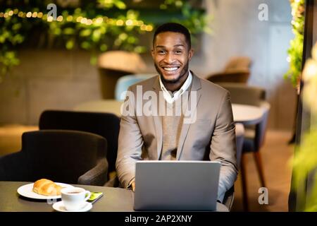 Headshot of handsome afro man looking at camera Stock Photo