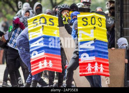 Hooded in riots in the Colombian national strike Stock Photo