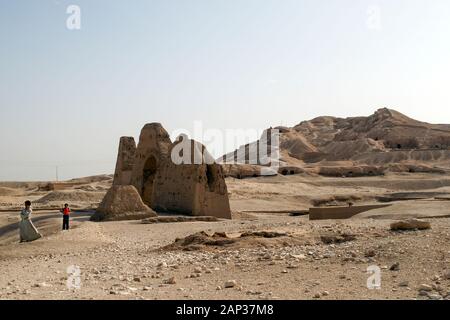 Egypt, Valley of the Kings. Two young men at an archaeological site near the Tombs of the Princesses. Stock Photo