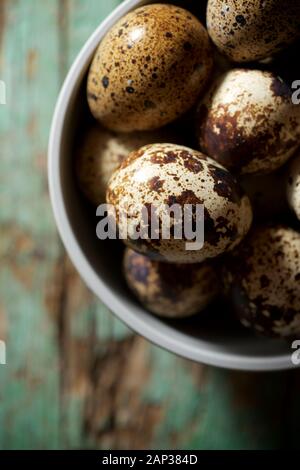 Quail eggs on a wooden table. Stock Photo