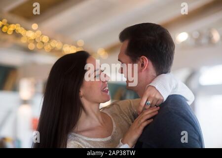young couple dancing inside togetherness Stock Photo