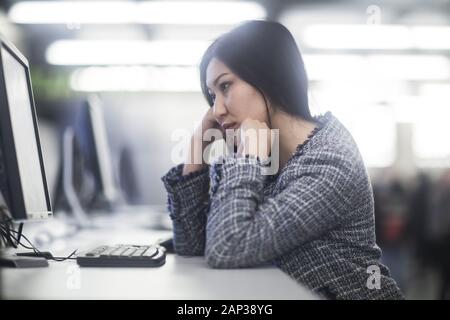 young woman inside working concentrate Stock Photo