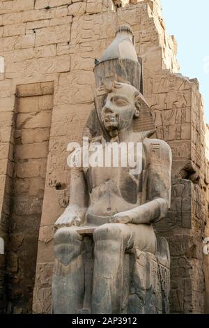 Egypt,Luxor, Luxor Temple,معبد الاقصر; Thebes. The statue of Ramses II near the entrance by the obelisk. Stock Photo