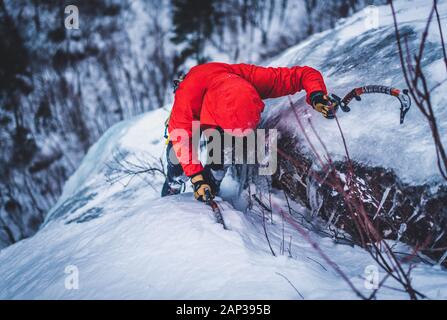 Man ice climbing on Cathedral Ledge in North Conway, New Hampshire Stock Photo