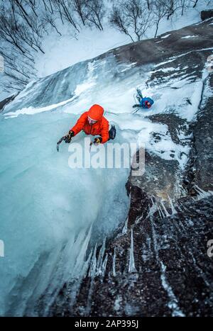 Man ice climbing on Cathedral Ledge in North Conway, New Hampshire Stock Photo