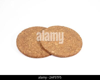 The close up of wooden cork coasters on white background. Stock Photo