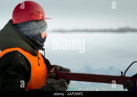 Portrait of a worker with a balaclava on his head in profile Stock Photo