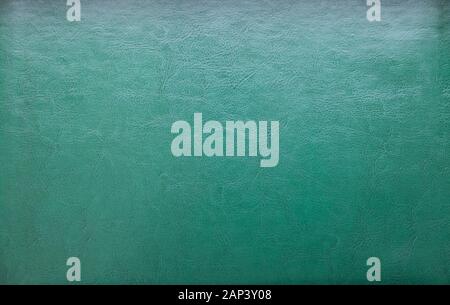 a natural green leather texture. close up. Stock Photo