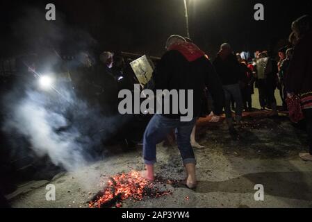 Langadas, Greece. 20th Jan, 2020. A firewalker walks on smoldering coals during the custom of ''Anastenarides''. Firewalking or ''Anastenaria'' is a religious old tradition in Greece held three times every year in many villages of Northern Greece. Firewalking have been traced back to the ancient rites of Dionysus, the Greek god of revelry. Credit: Giannis Papanikos/ZUMA Wire/Alamy Live News Stock Photo
