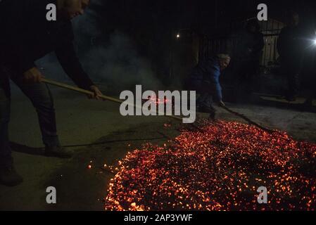 Langadas, Greece. 20th Jan, 2020. People prepare the fire for ''Anastenarides'' ahead of the firewalking. Firewalking or ''Anastenaria'' is a religious old tradition in Greece held three times every year in many villages of Northern Greece. Firewalking have been traced back to the ancient rites of Dionysus, the Greek god of revelry. Credit: Giannis Papanikos/ZUMA Wire/Alamy Live News Stock Photo