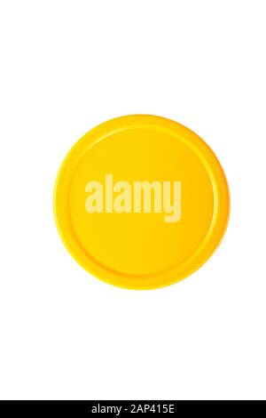 yellow round cap isolated on white background. Top view of yellow plastic lid. Stock Photo