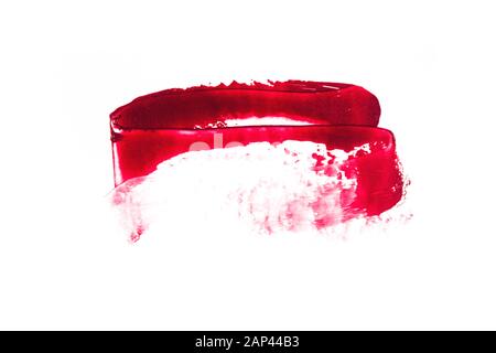 Smear of red lipstick on a white isolated background. Stock Photo