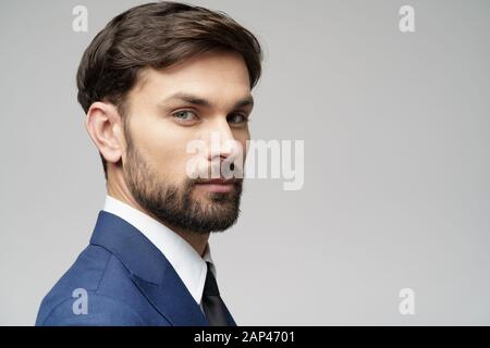 Studuo shot of thinking businessman wearing suit Stock Photo