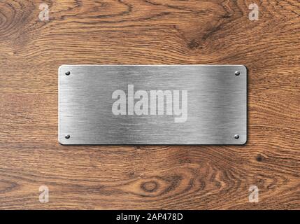 Blank polished silver plate on wooden background to ad text, names or logos Stock Photo