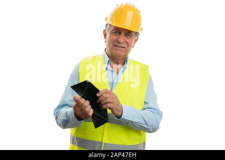 Smiling old male builder presenting empty wallet as optimistic concept isolated on white Stock Photo