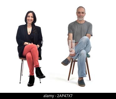 couple sitting on a vintage chair isolated on white Stock Photo