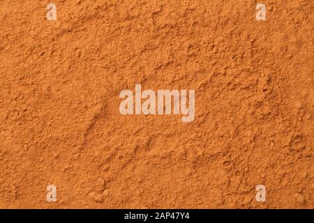 Cinnamon powder background. Full frame texture. Top view, flat lay Stock Photo