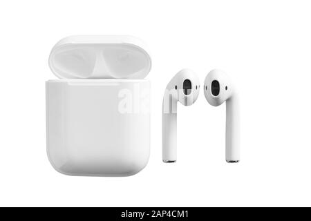 White headphones wireless earphones with case, copy space isolated background Stock Photo