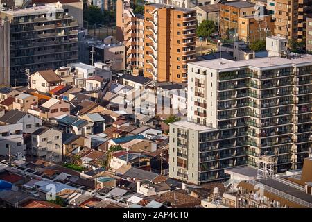 The birds eye view of modern and traditional styles of Japanese residences: the single-family detached house and the multiple-unit building in the cen Stock Photo