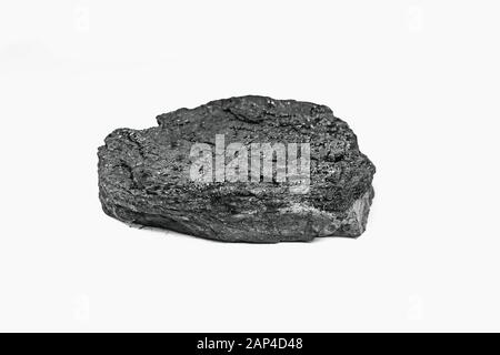 Pieces black coal lie on white isolated background, copy space Stock Photo