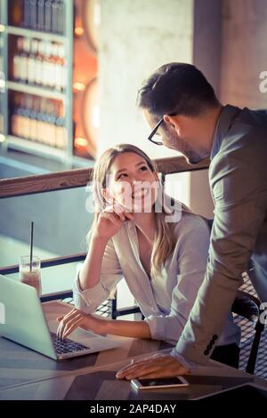 Programmers working in a software developing company office Stock Photo