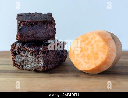 close up plant based vegan chocolate brownies made from sweet potatoes on a plan background for copy space Stock Photo