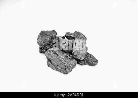 Pieces black coal lie on white isolated background, copy space Stock Photo