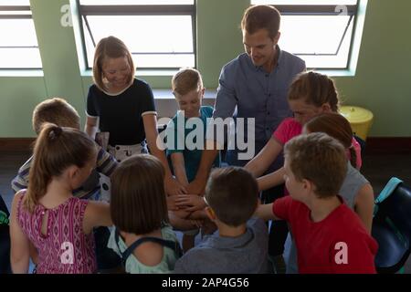 Group of elementary school kids sitting in a circle Stock Photo