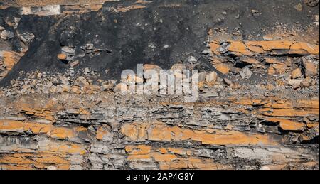 Geological section of soil, layers of coal. Overburden open mine anthracite. Consequences after rock explosion Stock Photo