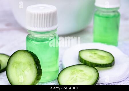 Cosmetics with cucumber extract on table Stock Photo - Alamy
