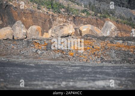 Geological section of soil, layers of coal gold. Overburden open mine anthracite. Consequences after rock explosion Stock Photo