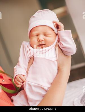 close up. mom dressing her newborn baby for a walk. Stock Photo