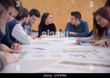 Group of  university architecture students working on practice lessons. Looking for solution during class. Stock Photo
