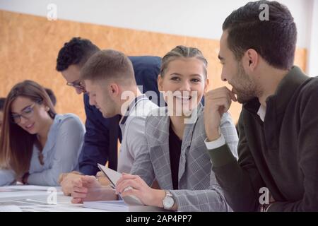 Group of  university architecture students working on practice lessons. Looking for solution during class. Stock Photo