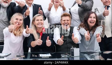 large group of happy employees showing their success Stock Photo