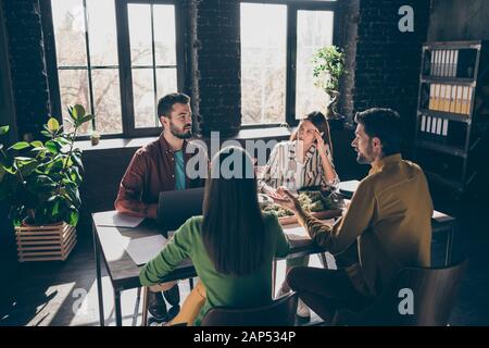Skilled professional experienced businesspeople specialists sharks experts financier wearing casual formal-wear discussing IT contract at modern Stock Photo