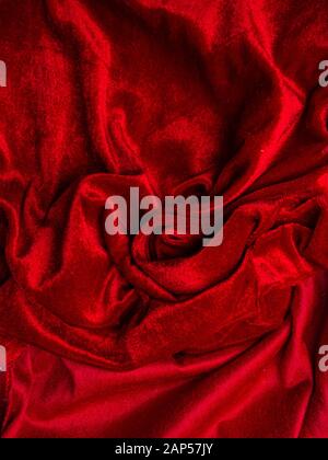 deep red velvet texture for background, red rose shape, love and passion concept. very affectionate and passionate. Stock Photo