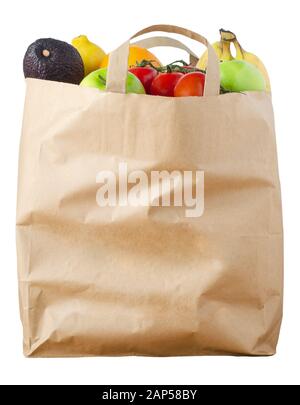 A brown paper shopping bag, filled to the top with varieties of fruit, cut out and isolated on a white background. Stock Photo