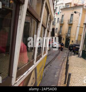 Lisbon, Portugal - riding the old tram through the narrow streets Stock Photo