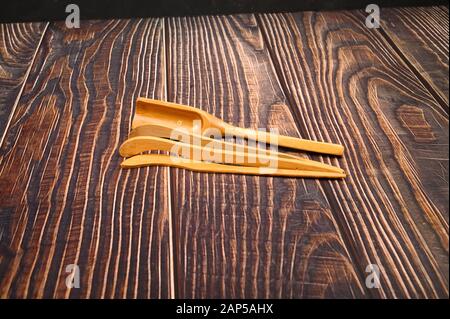 Devices for traditional Chinese tea drinking made of bamboo on a wooden background. Close up Stock Photo