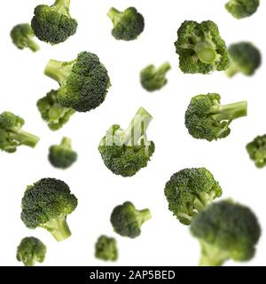 Flying broccoli isolated on white background, pattern Stock Photo