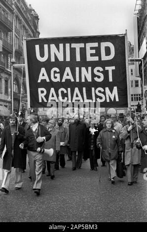Racism 1970s London UK. United Against Racialism Labour Party and TUC rally and march Trafalgar Square 1976 England. Tom Jackson, General Secretary of the Union of Post Office Workers, (centre under 'A' ) and Barbara Castle Labour MP to his left. HOMER SYKES Stock Photo