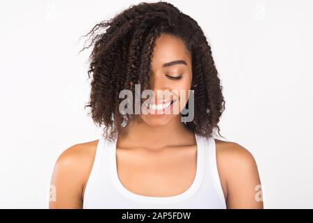 Close up of sweet black girl looking down Stock Photo