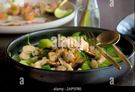 Asian, vietnamese cuisine. Steamed bok choy with mushrooms and steamed rice on the side. Close up shot. Stock Photo