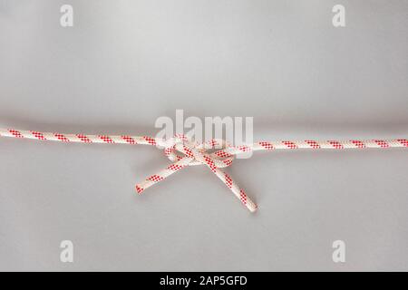 Carrick bend ship knot on grey background Stock Photo