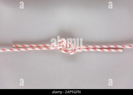 Figure eight Bend or Flemish Bend ship knot on grey background Stock Photo