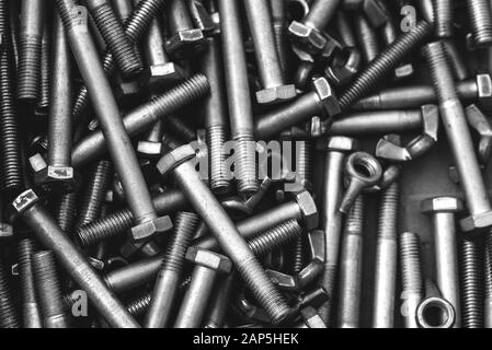 Long stainless steel bolts. Silver color metal parts. View from above Stock Photo